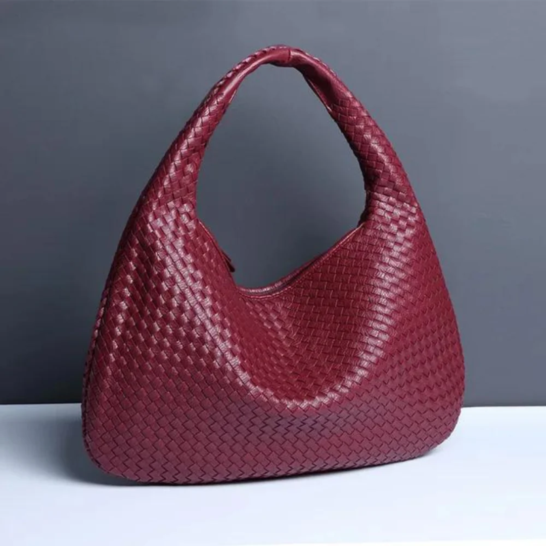 NORA - BORSA A MANO INTRECCIATA DI TENDENZA