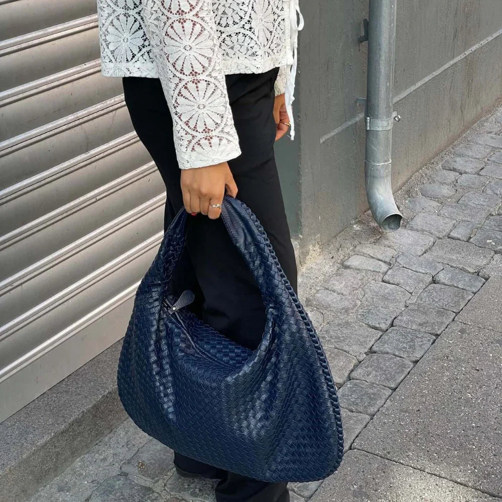 NORA - BORSA A MANO INTRECCIATA DI TENDENZA