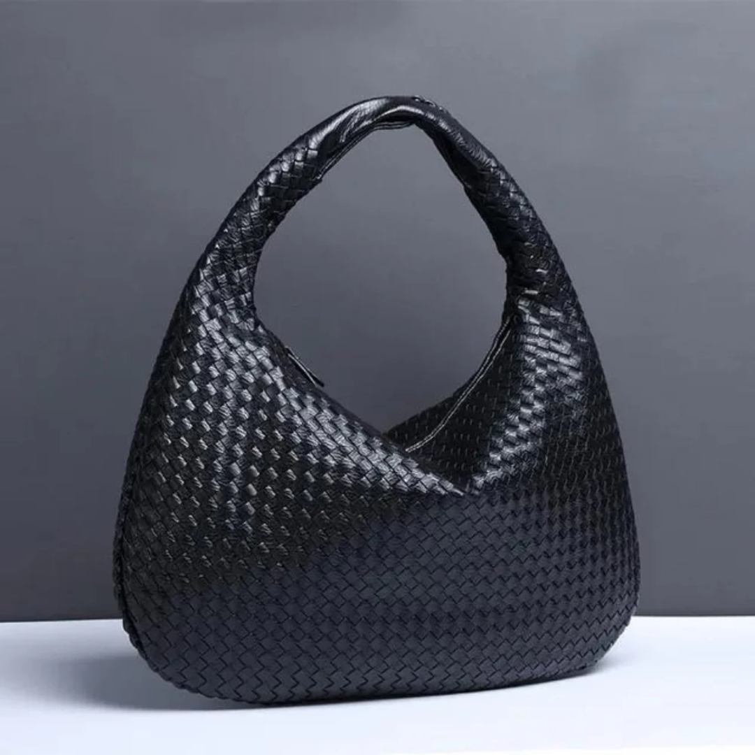NORA - BORSA A MANO INTRECCIATA DI TENDENZA