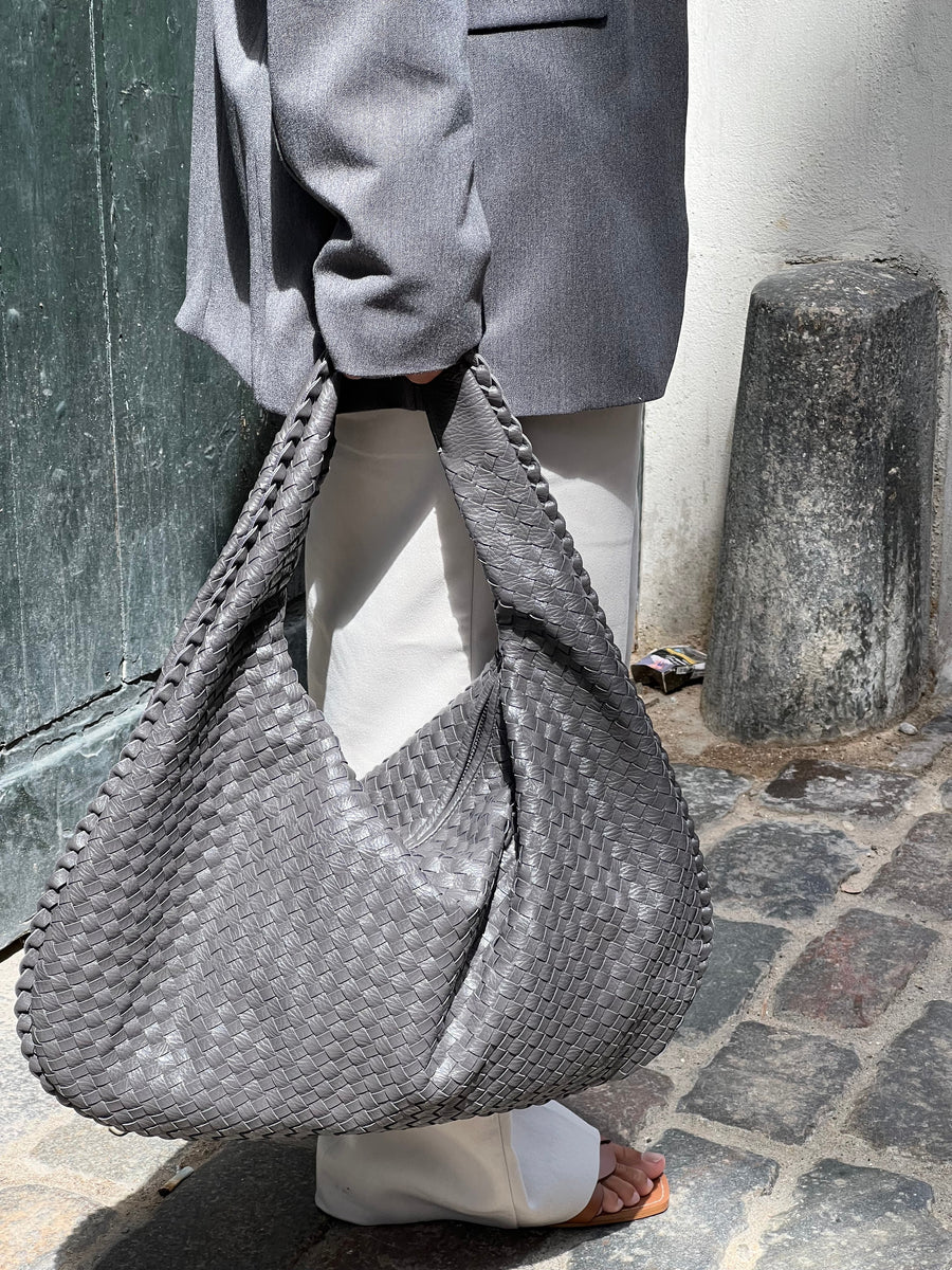 NORA - BORSA A MANO INTRECCIATA DI TENDENZA